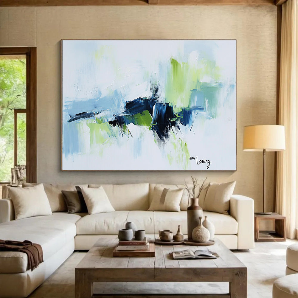 Abstract painting with a white background highlighted by light blue and green accents features expressive brush strokes and the words am loving.SC214