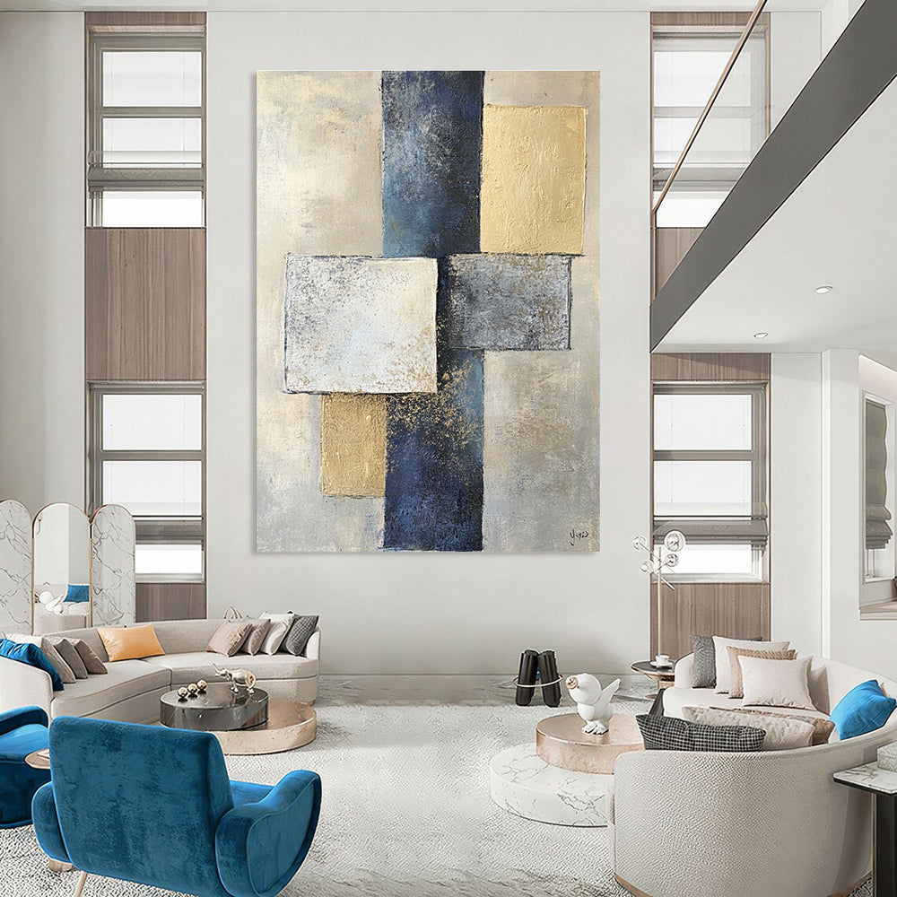 Abstract painting featuring two squares and one rectangle in varying shades of gray on textured paper with a beige and blue color palette.STSC715