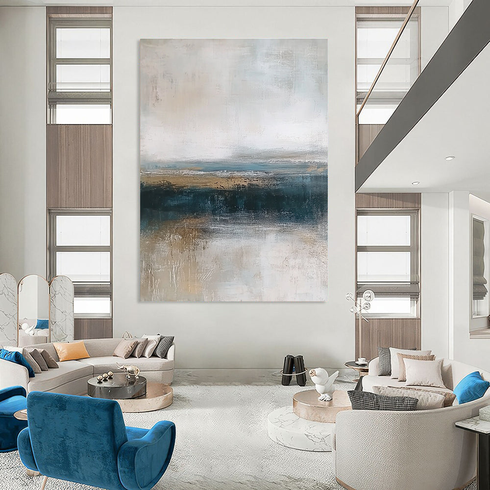Large abstract painting depicting textured ocean waves in blue and gray with a soft beige sky and earthy shore tones for a tranquil ambiance.STSC463