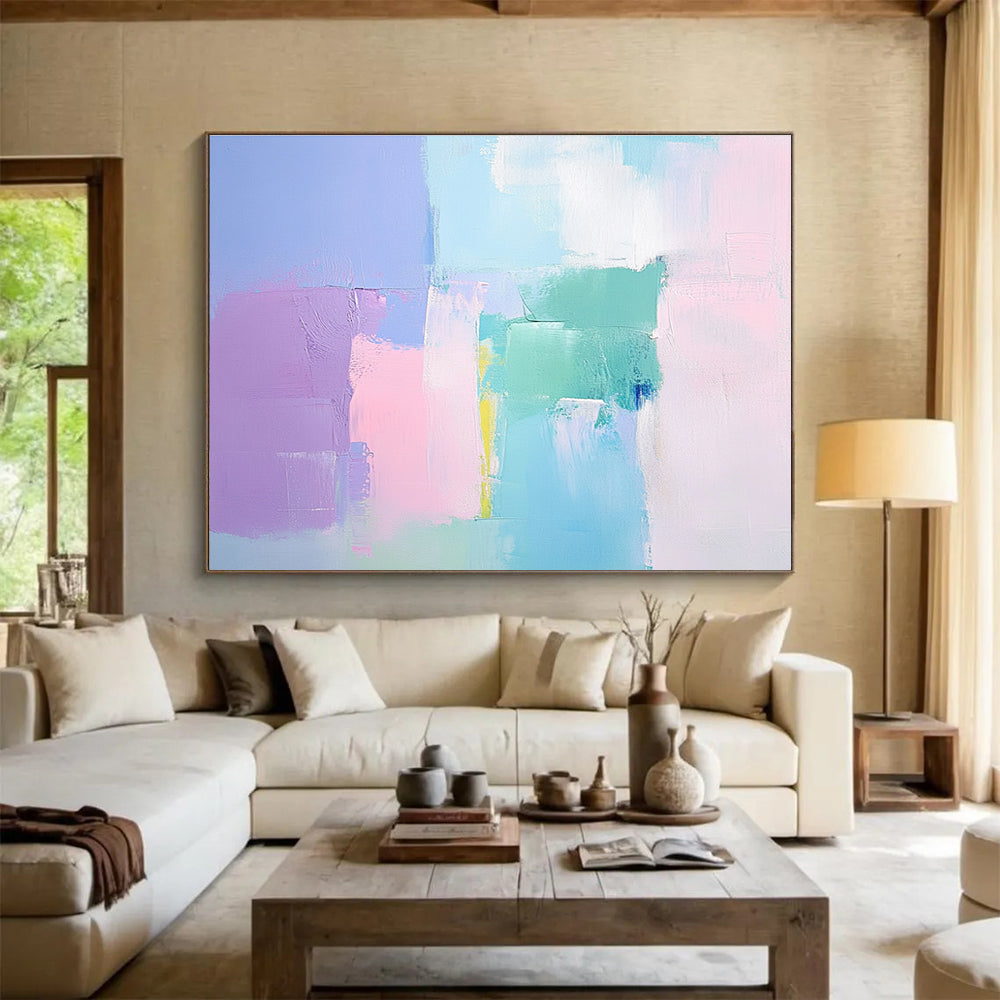 Large abstract painting with soft pastel colors thick brush strokes and a minimalist impressionist style featuring pink blue and light green tones.SC255