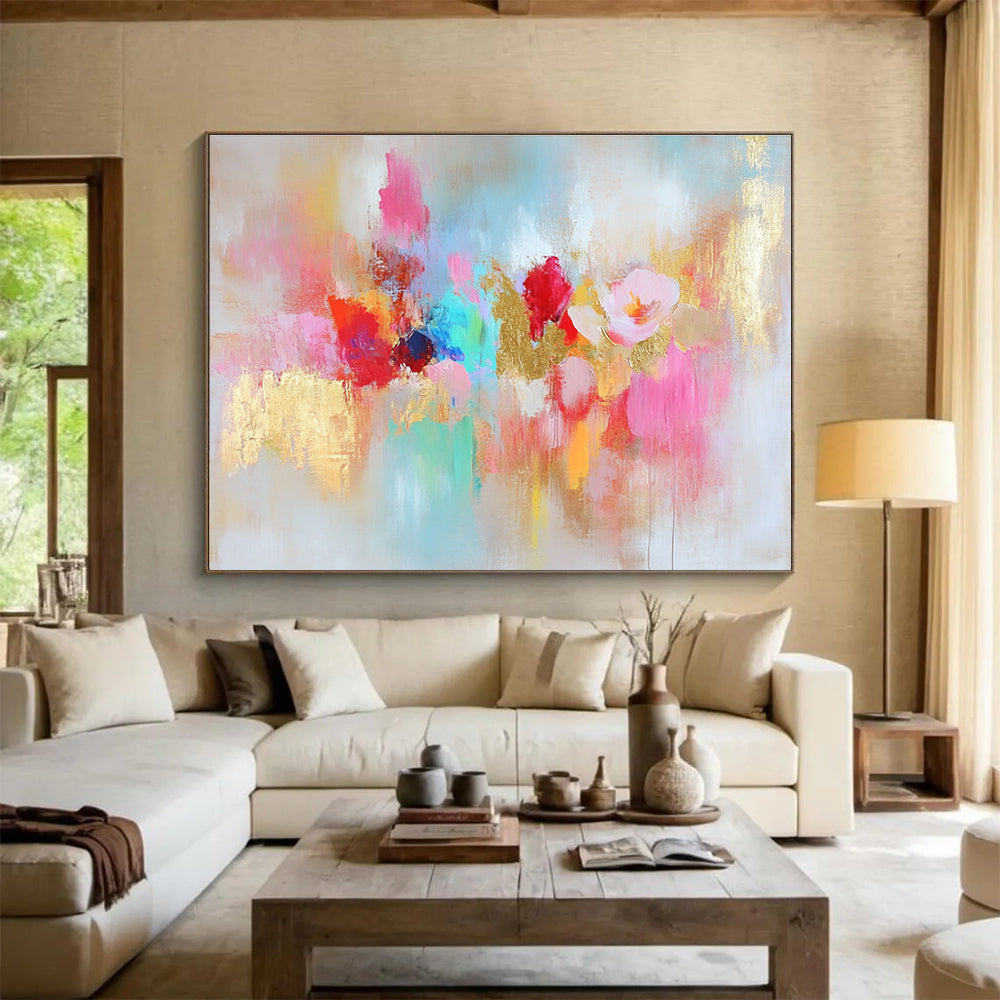 Large abstract painting with vibrant colors and gold leaf accents symbolizing happiness creativity and hope on a soft textured white background.SC264