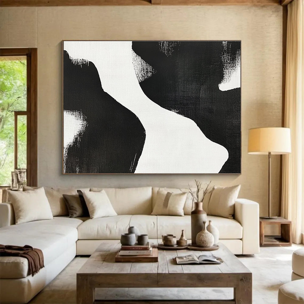 Large abstract painting featuring black and white brush strokes depicting two women’s bodies against a plain white background, showcasing minimalist artistry and tranquil form.SC439