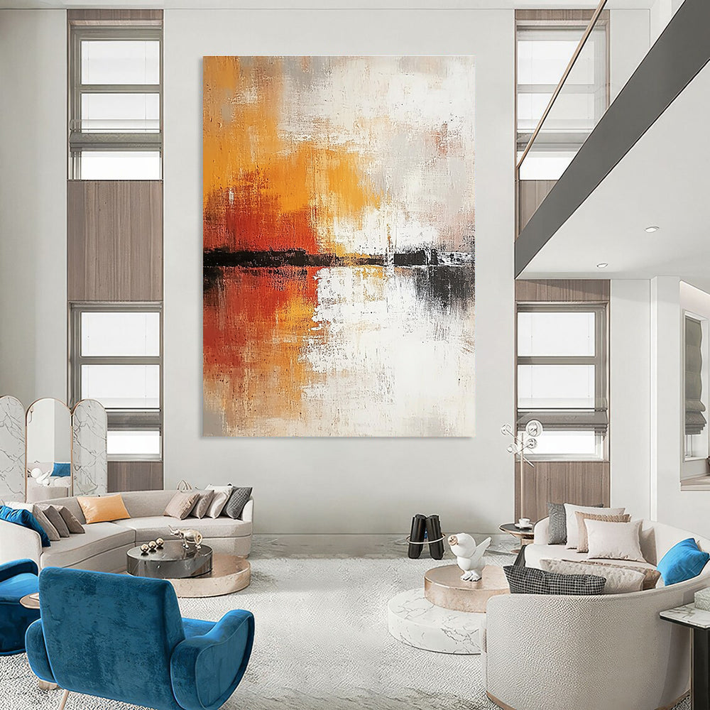Large abstract painting in soft white and grey tones with warm orange and yellow accents featuring expressive brush strokes and rich texture.STSC813