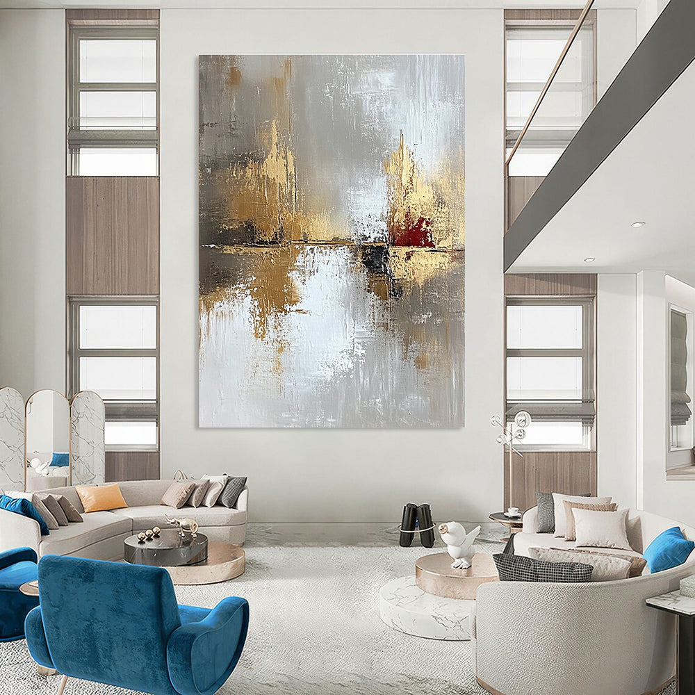 Large abstract painting in light gray and gold with oil brush effect featuring layers of texture and subtle red accents for visual impact.STSC402