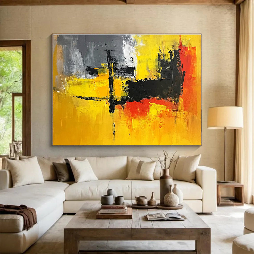 A large abstract painting featuring vibrant yellow, grey, and black hues, perfect for enhancing any contemporary space.SC393