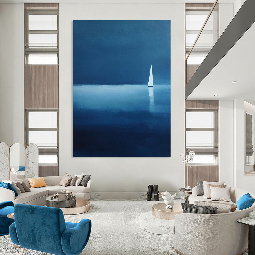Large abstract painting of a serene sailboat on calm waters using blue and white shades against a dark backdrop evoking tranquility and solitude.STSC1086