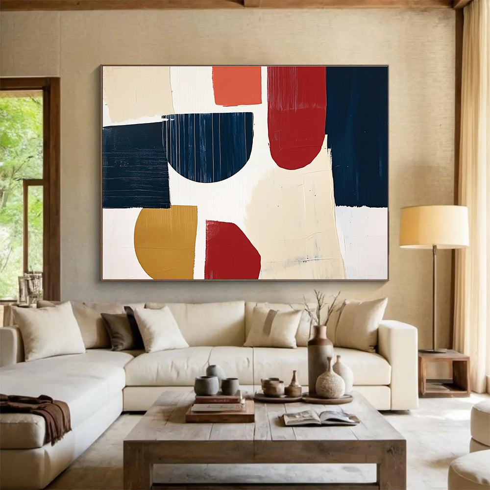 A large abstract painting featuring navy blue cream and red shapes with loose brush strokes on a white background in a collage style.SC489