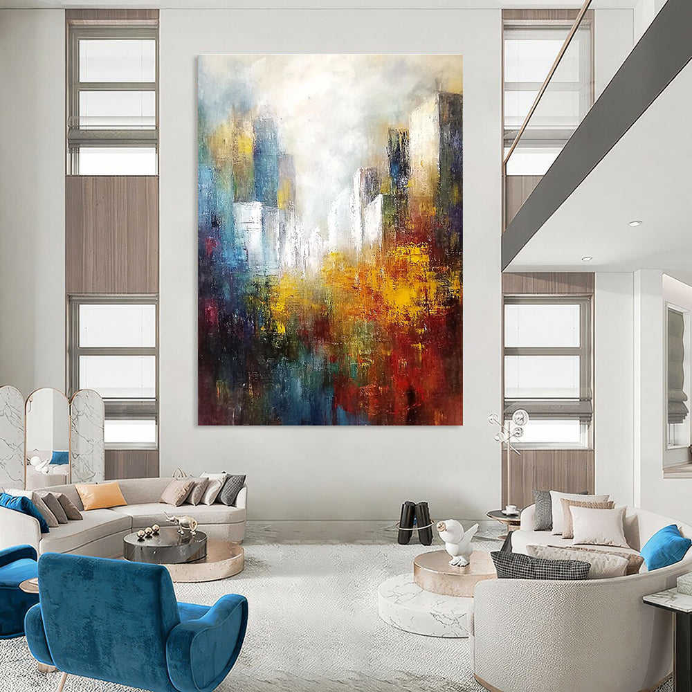Large abstract landscape painting featuring white buildings in the distance with soft edges and muted tones in a light sky blue and dark amber palette.STSC106