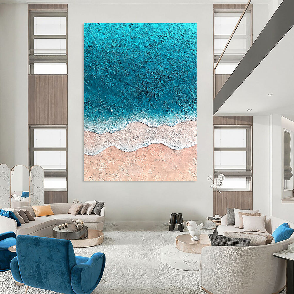 Large abstract painting featuring textured sand and vibrant blue sea with soft watercolor gradients creating an immersive oceanic experience.STSC1428