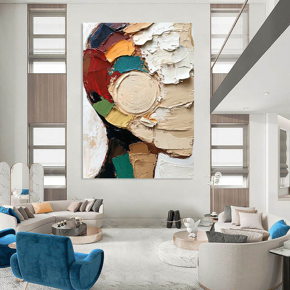 Large abstract painting featuring a textured close-up of a face in vibrant colors and dynamic brush strokes against a white circular patterned background.STSC283