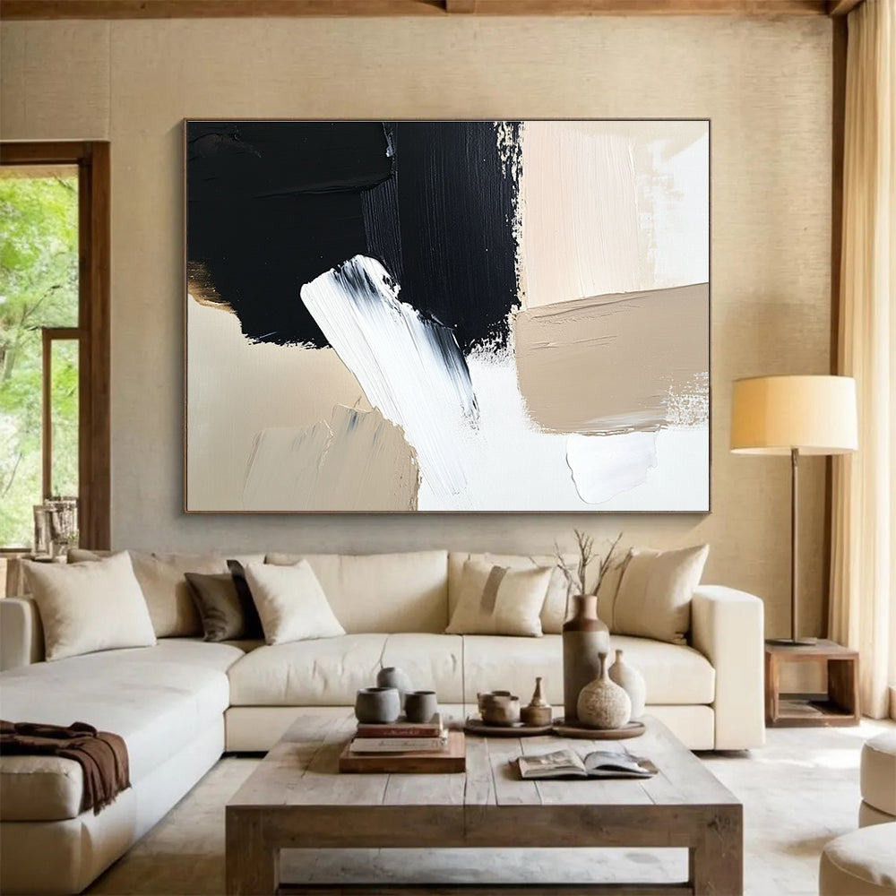 Large abstract painting featuring black brush strokes on a white background complemented by a minimalist beige and cream color palette.SC012