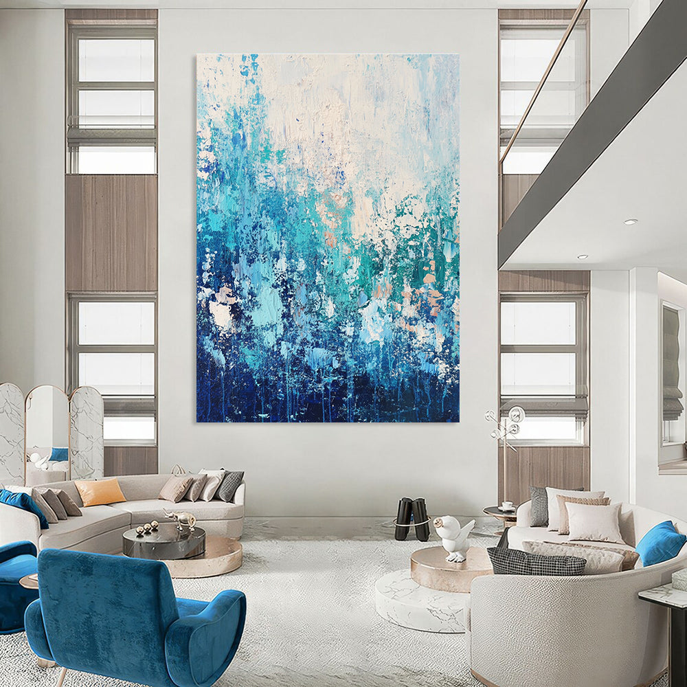 Large abstract painting featuring water and sky-inspired colors with a paint-dripping technique that evokes movement and depth.STSC452