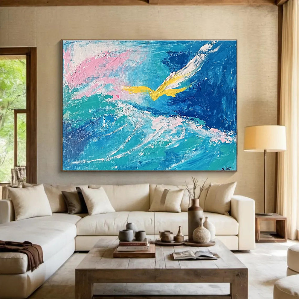 Large abstract painting featuring fluid turquoise and blue tones with pink highlights, a yellow bird, and a whimsical smile hidden within the waves.SC364