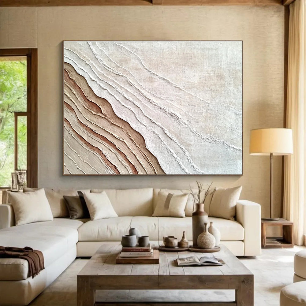 An abstract painting featuring the interplay of sand and water in white and brown hues, symbolizing growth and change through rich textures.SC448