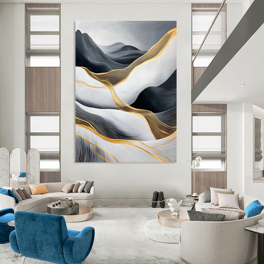 Large abstract painting of flowing waves in light gray and black with gold accents and prominent white areas and mountains.STSC358