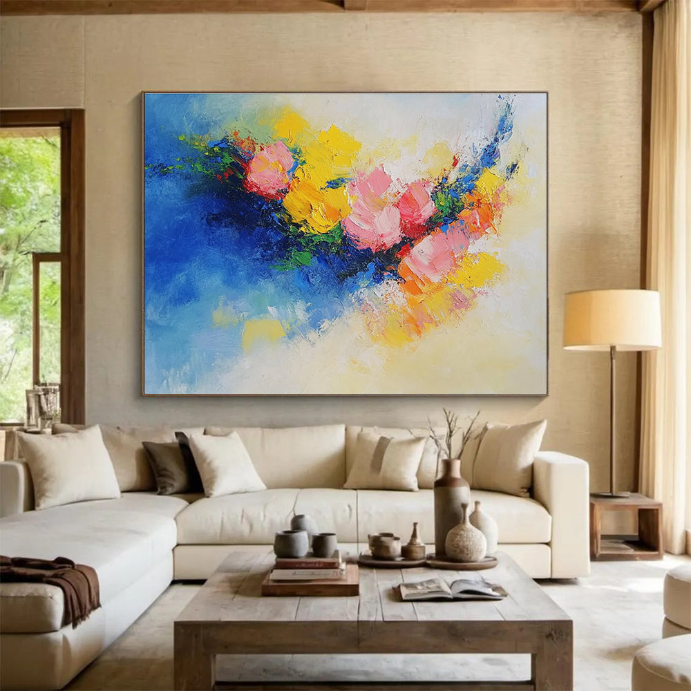 Large abstract painting of flowers in vibrant yellow, blue, and pink featuring textured palette knife techniques. Perfect for modern decor.SC190