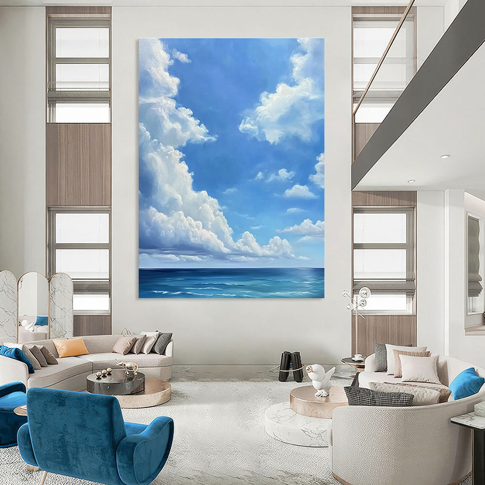 A large abstract painting featuring a blue sky with white clouds and a vast ocean below in a minimalist oil painting style.STSC923