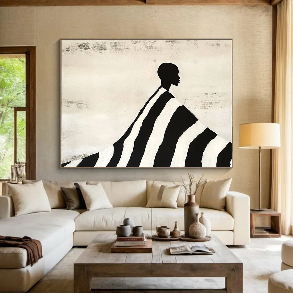An abstract painting featuring a silhouette of an African man draped in a black and white striped blanket, evoking Tim Walker's artistic style.SC428