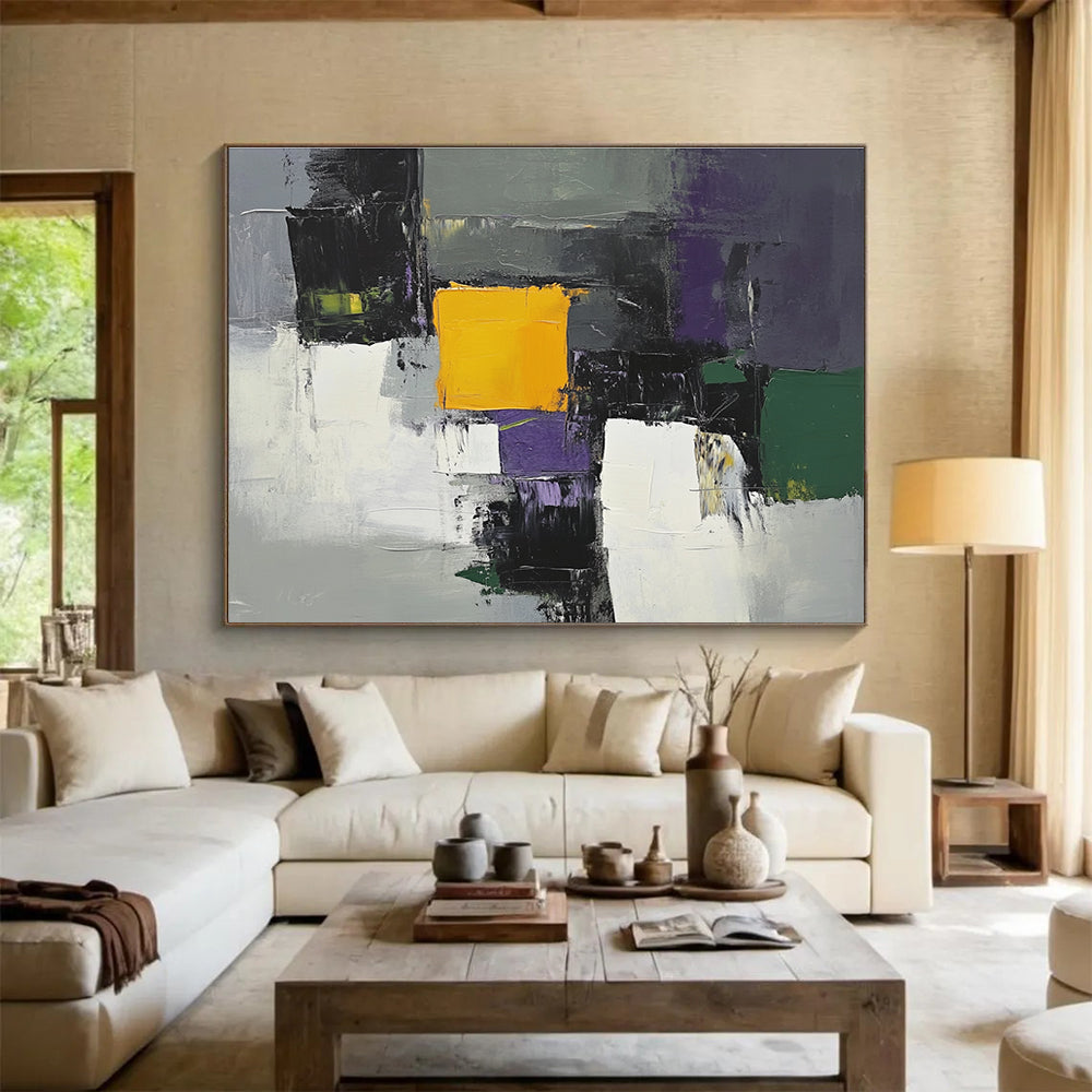 This large abstract painting features gray white and purple shapes with a central yellow square and green and olive accents using thick brush strokes.SC324