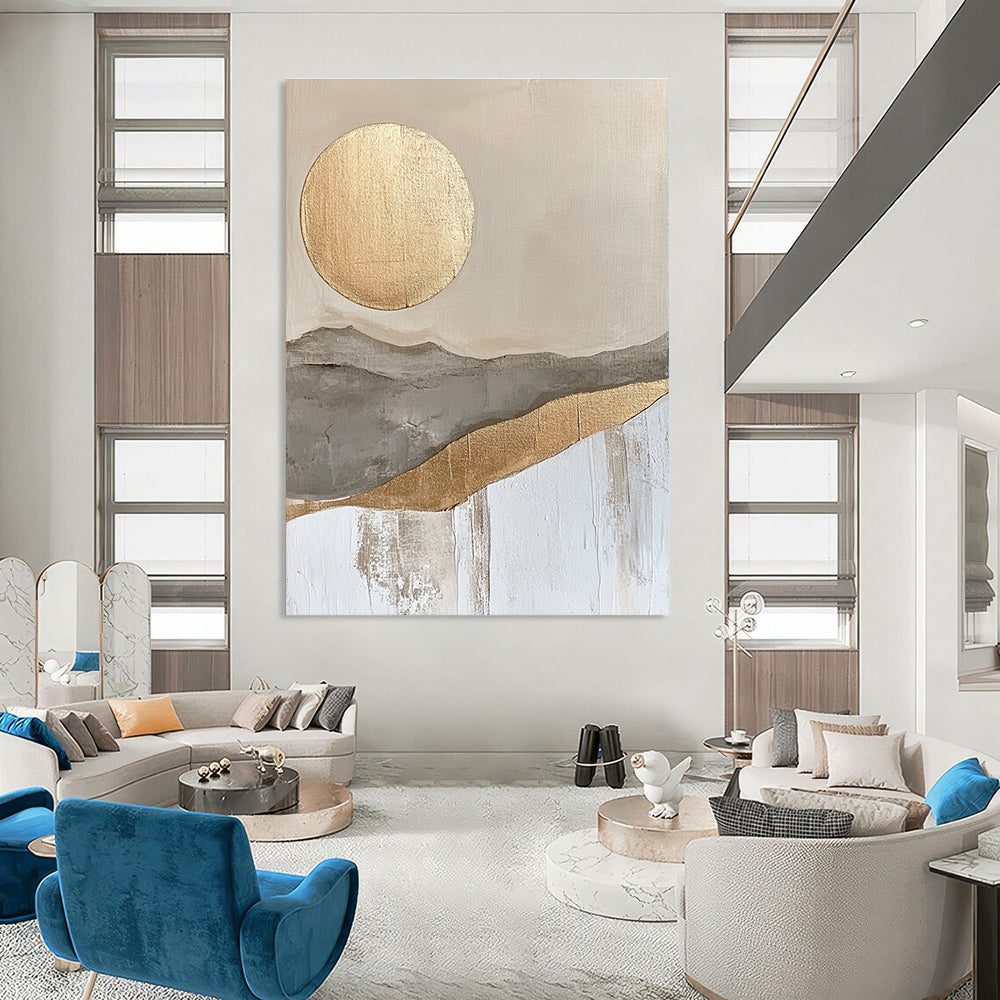 Large abstract painting featuring a golden sun and moon in a soft gray beige and white landscape with textured gold accents.STSC126