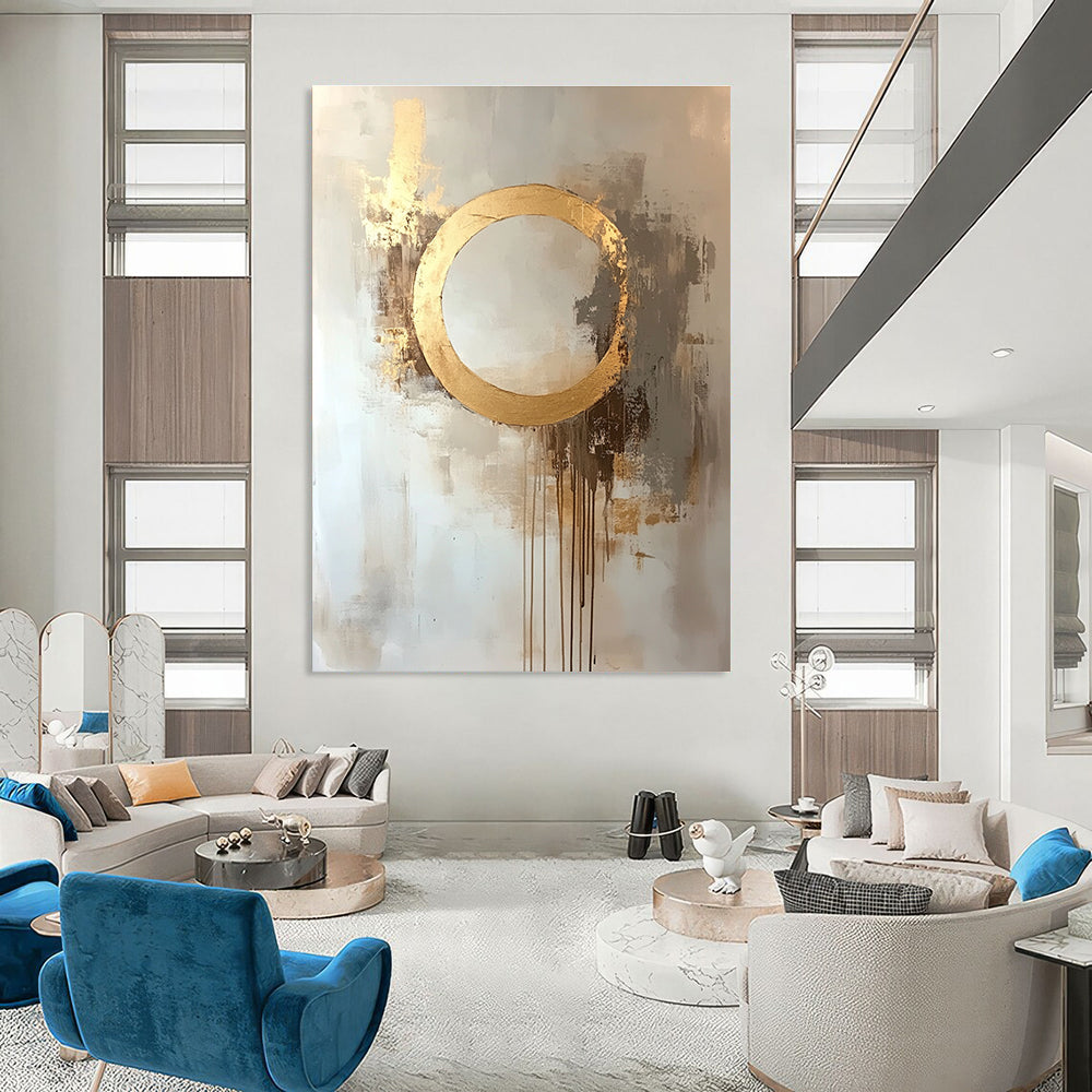 Large abstract oil painting featuring a moon with a golden circle in beige and gold tones with dripping gold leaf on a white background.STSC170