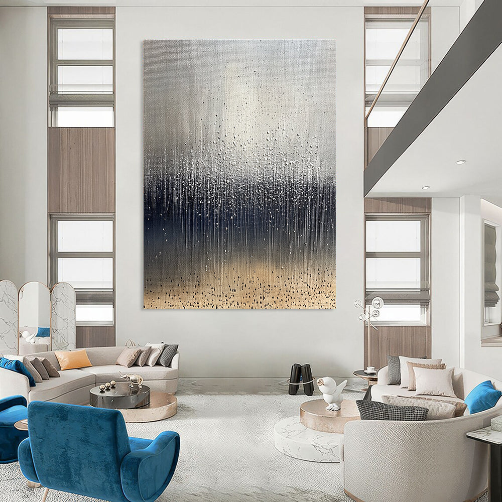 Large abstract painting depicting raindrops on brown soil with a cool gray background and splashing water droplets in dark blue and white tones.STSC1399
