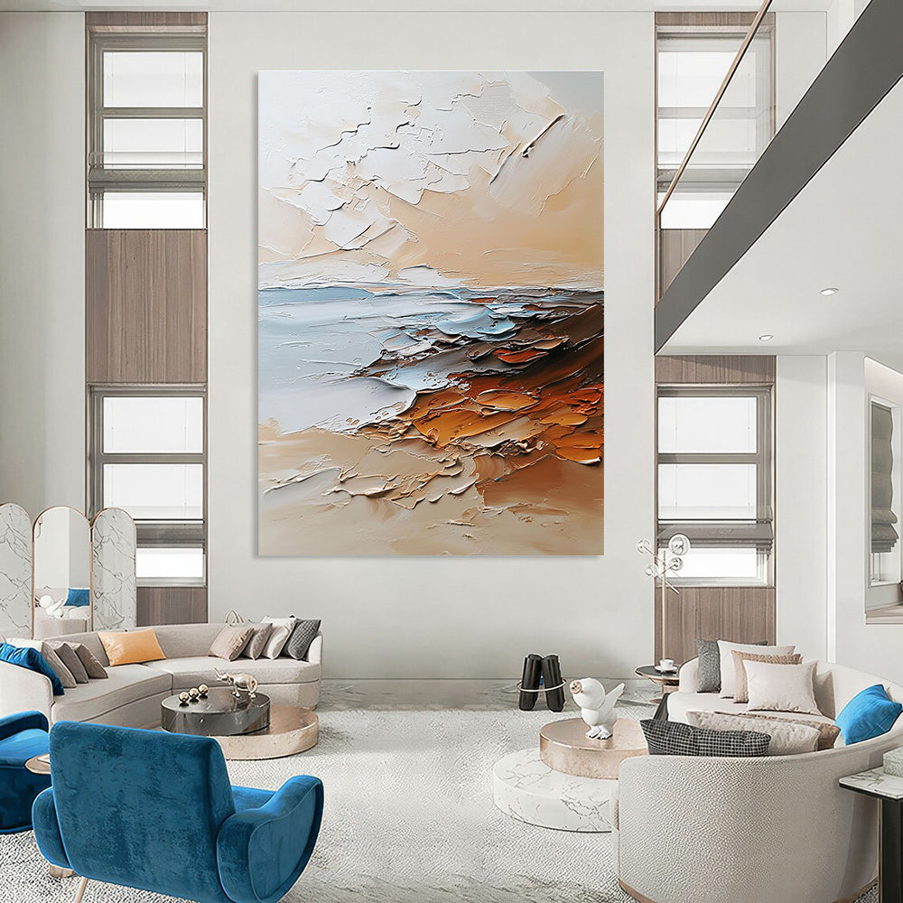 Large abstract painting in beige and white tones featuring textured brushstrokes with light orange brown and gray colors and soft edges.STSC096