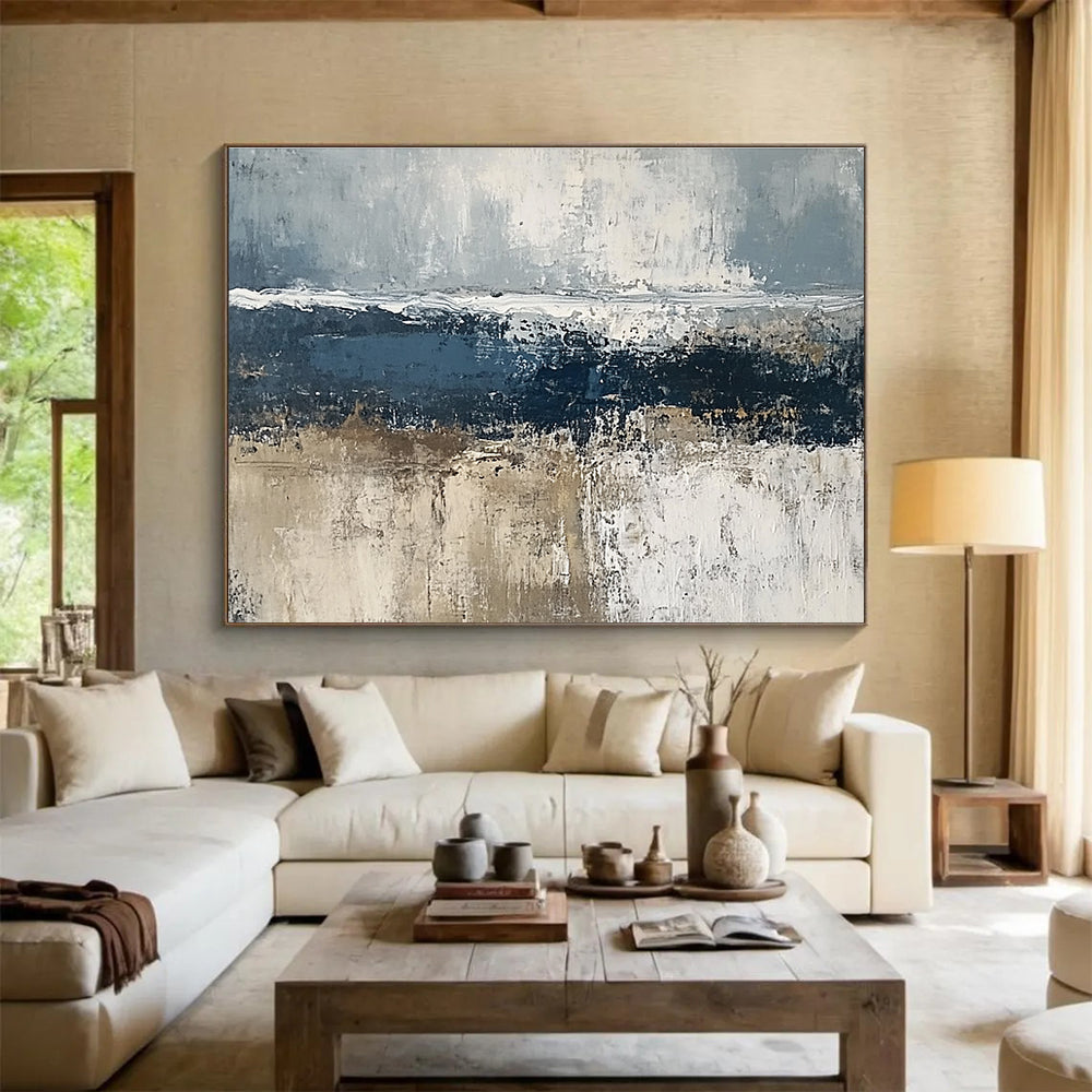 Large abstract painting of the sea featuring gray and dark blue tones with brown accents and thick textured paint.SC203