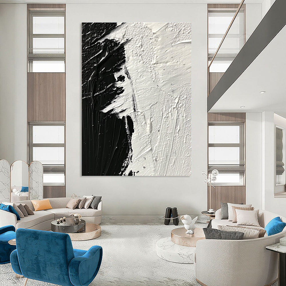 Large abstract painting featuring thick textured brushstrokes in striking black and white tones that evoke profound emotion and creativity.STSC1282