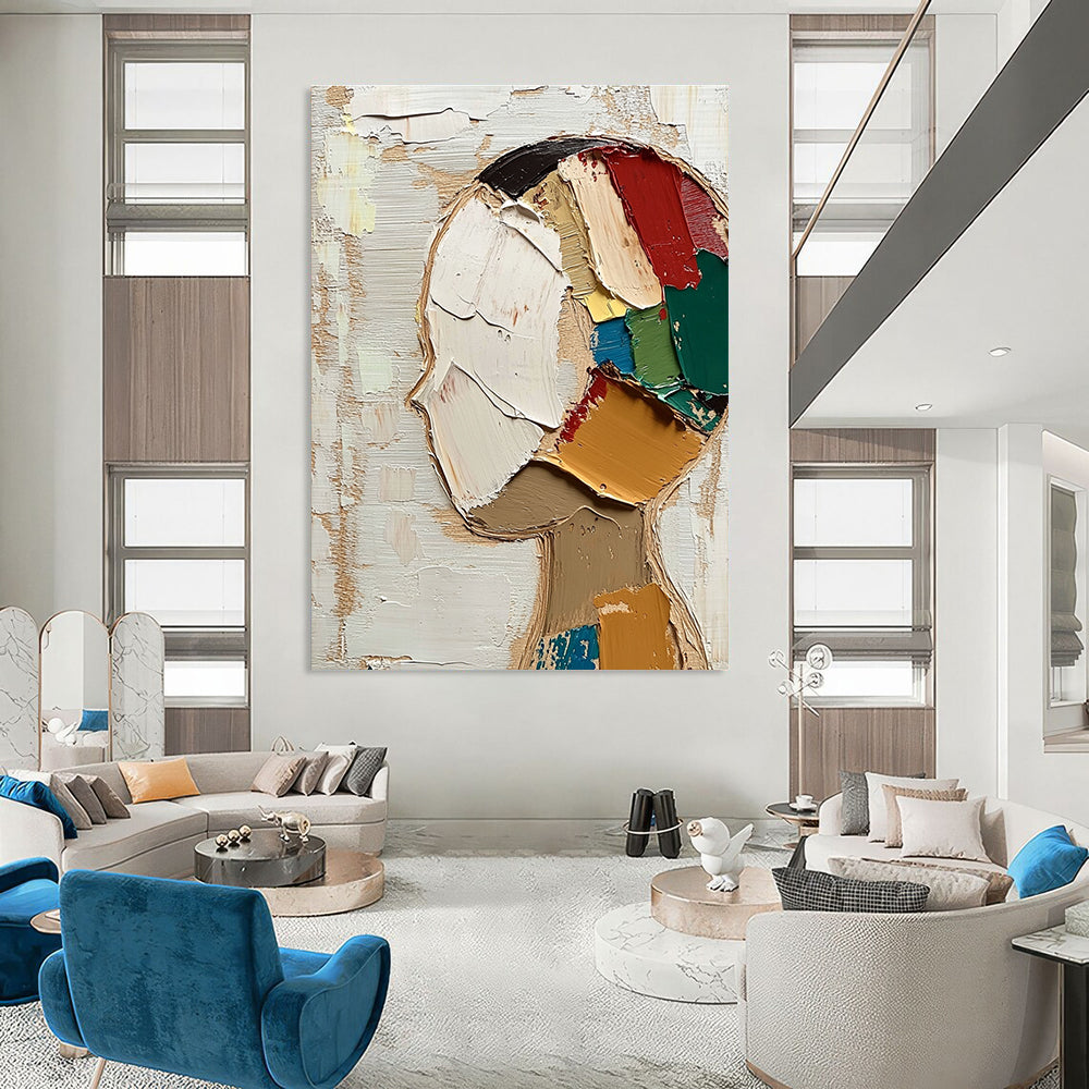 Large abstract painting featuring a round face with short hair in vibrant colors against a beige and white background with visible brush strokes.STSC197