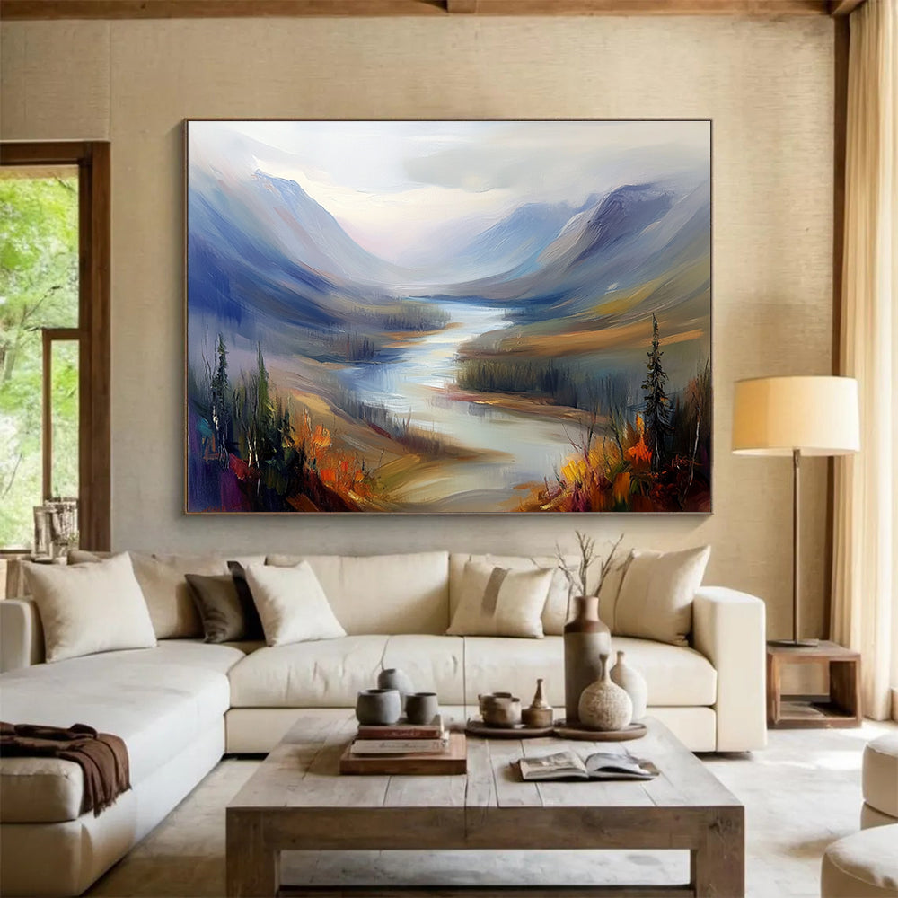 Large abstract painting of a misty Northern Canada river landscape featuring rolling hills and mountains in a warm color palette with soft brush strokes.SC405