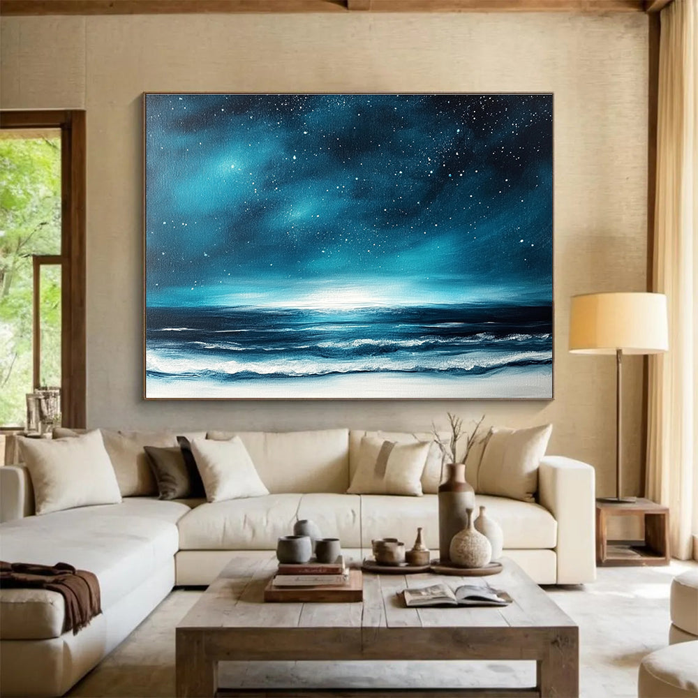 A large abstract painting featuring a dark blue sky with stars and ocean waves, accented with white and light teal hues.SC396