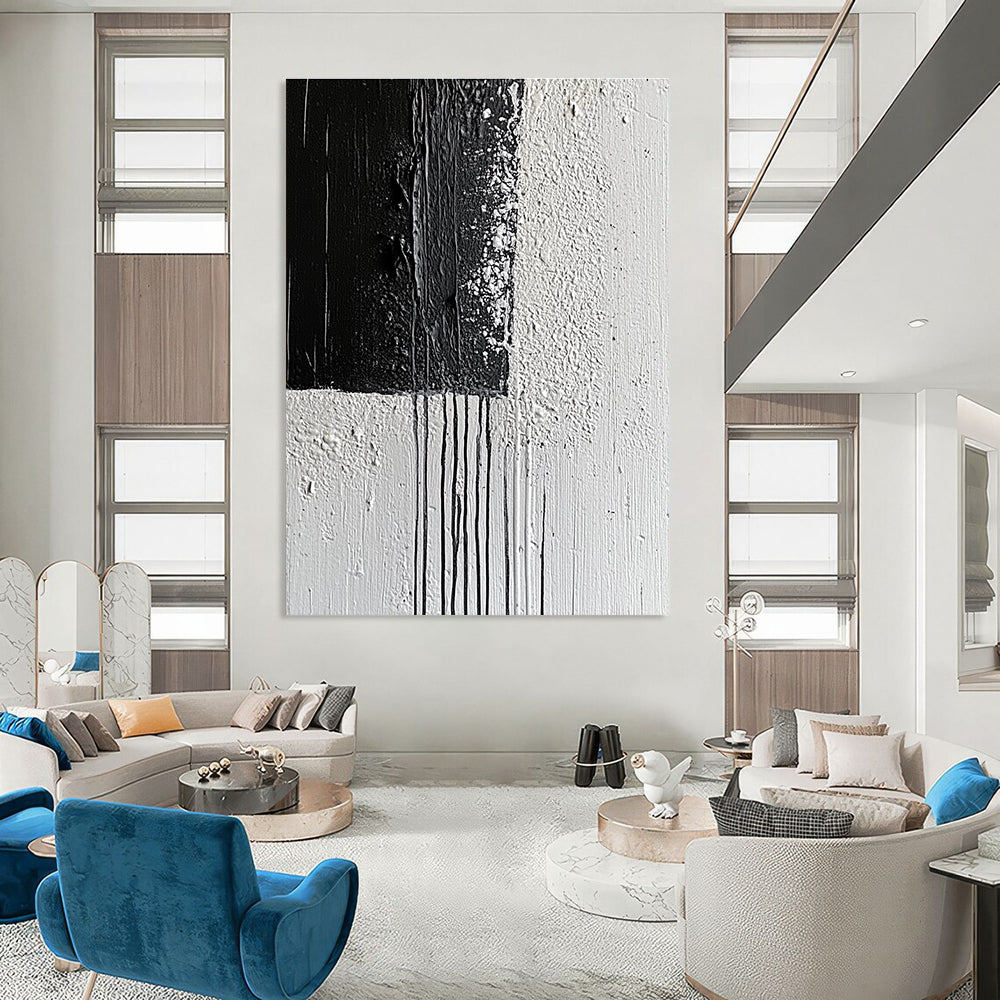 Large abstract painting with broad strokes and delicate paint drips on a textured canvas featuring a monochromatic gray color scheme.STSC539