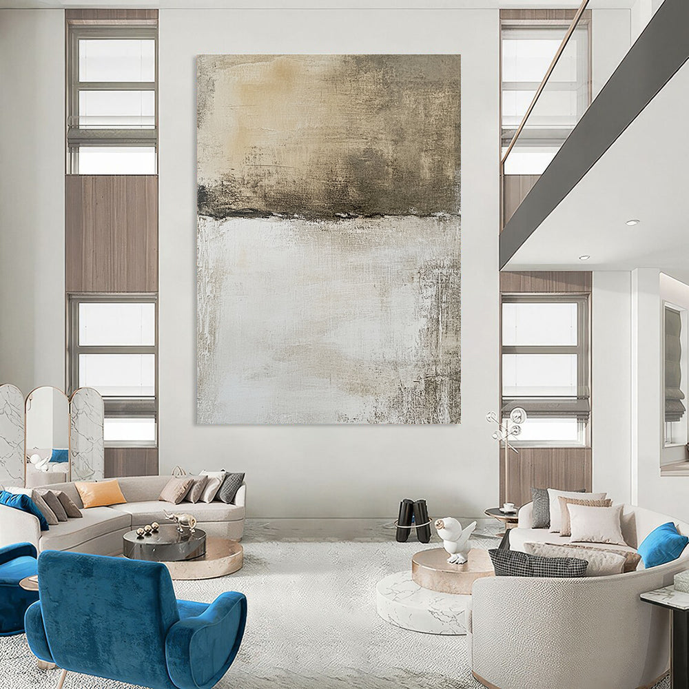 Large abstract painting features a neutral background with faded textures and brown shapes, evoking an aerial view of a landscape.STSC1103