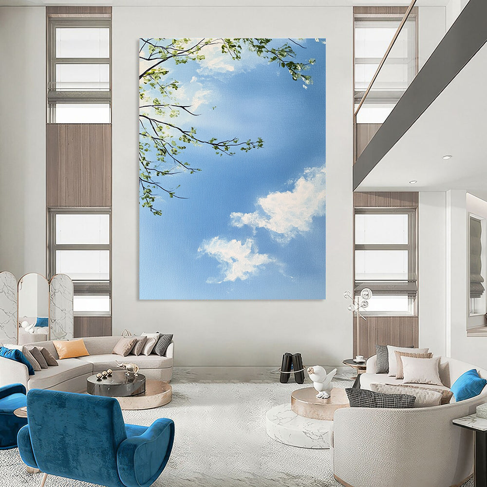 A large abstract painting capturing a serene sky with branches and leaves featuring delicate brushstrokes and soft colors for a tranquil atmosphere.STSC1195
