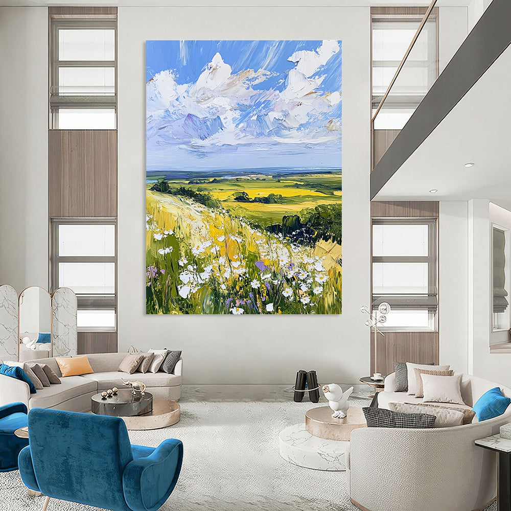 Large abstract painting of the English countryside featuring daisies under a vivid blue sky with fluffy white clouds in a whimsical style.STSC898