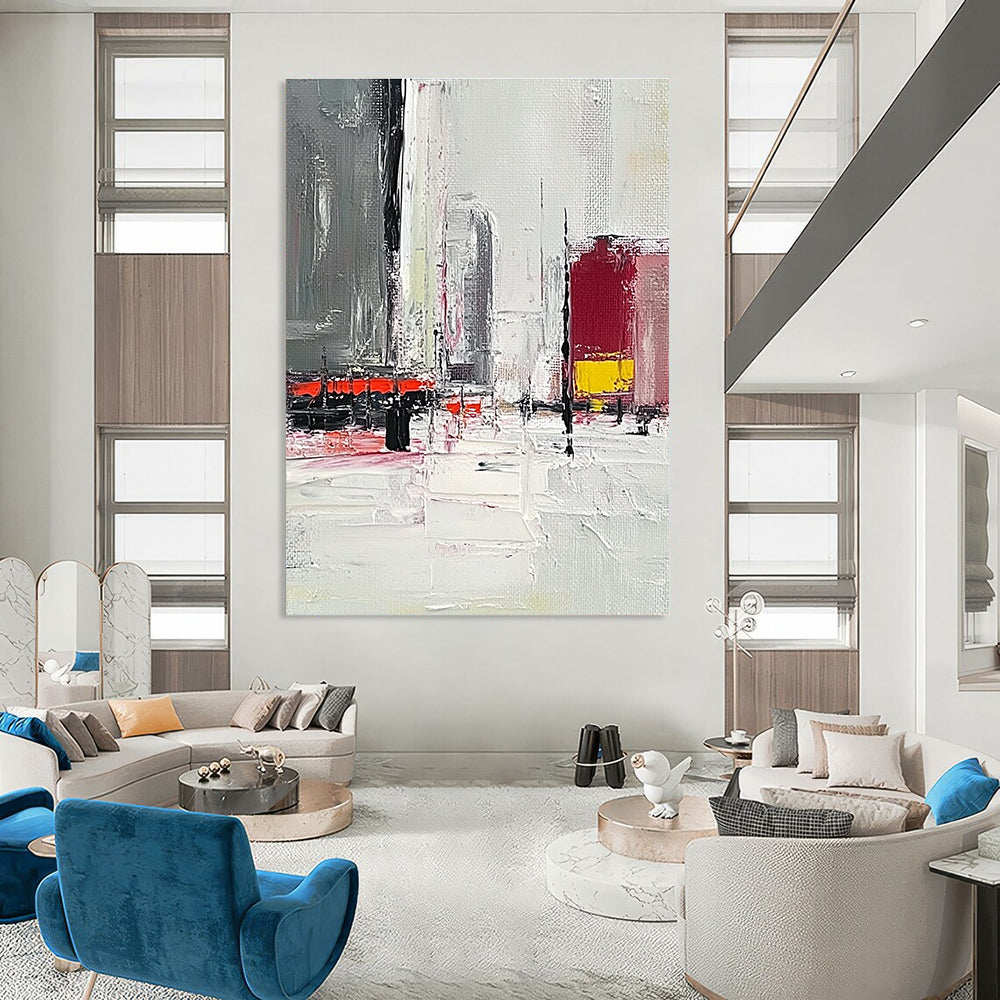 Large abstract painting featuring a grey and white urban landscape with red and yellow accents and thick brush strokes on a textured canvas.STSC154