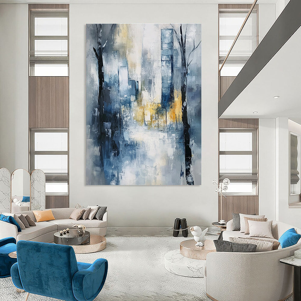 Large abstract painting of an urban cityscape in soft blue and grey tones with hints of yellow and white, featuring expressionist elements and a serene mood.STSC278