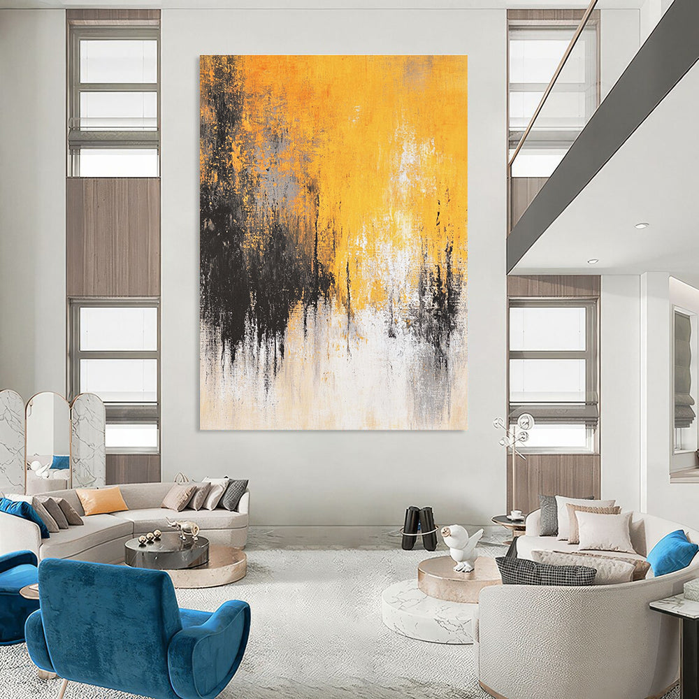 Large abstract painting featuring faded textures and dreamy shades of mustard yellow grey white and black depicting distant trees and a flowing river.STSC728