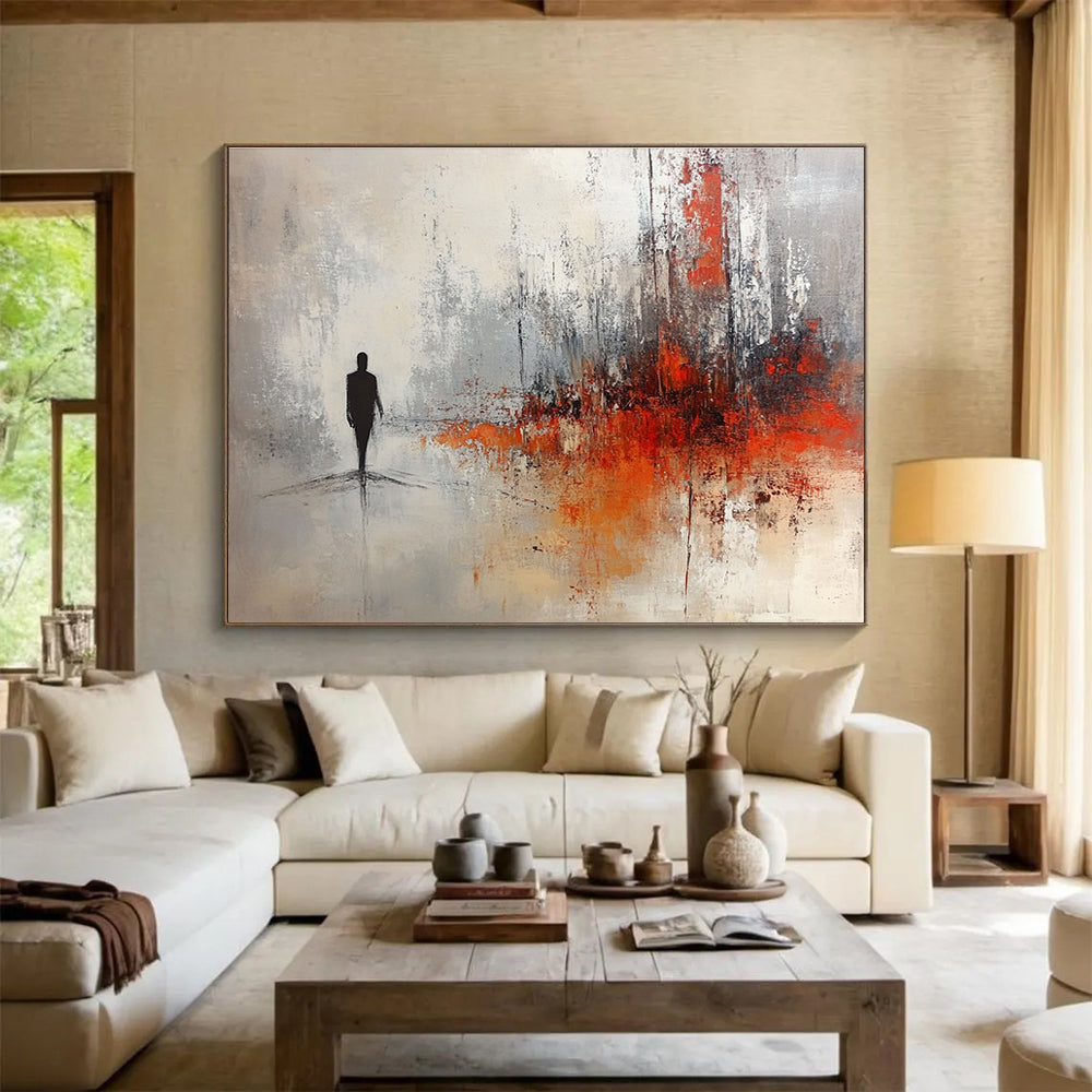 Large abstract painting in soft gray and white tones with red and orange splashes featuring a silhouette in an ominous landscape.SC258