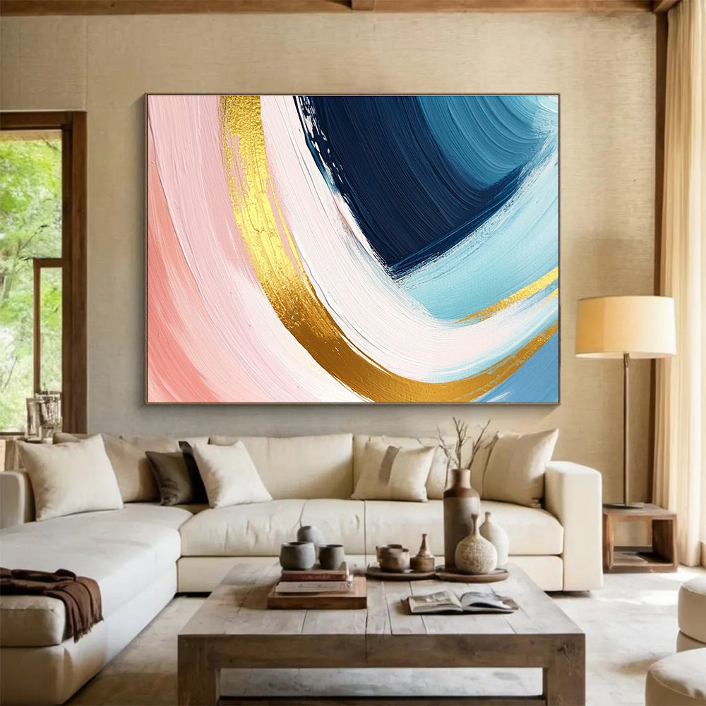 A large abstract painting in pastel pink blue and yellow with dynamic brushstrokes and gold outlines evoking joy and warmth.SC443