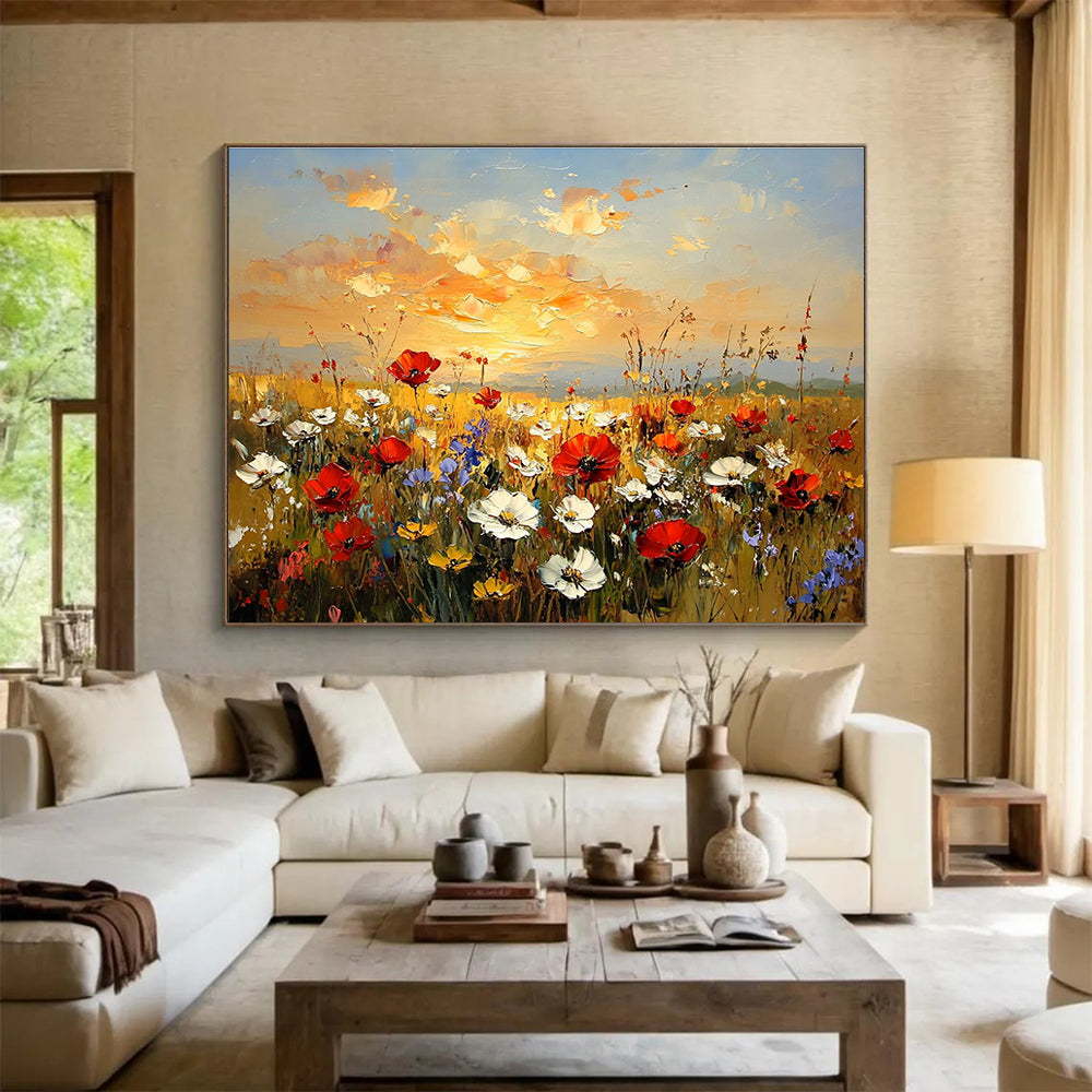 Large abstract painting of a wildflower field at sunset featuring red poppies white daisies and yellow sunflowers in vibrant hues of orange and blue.SC464