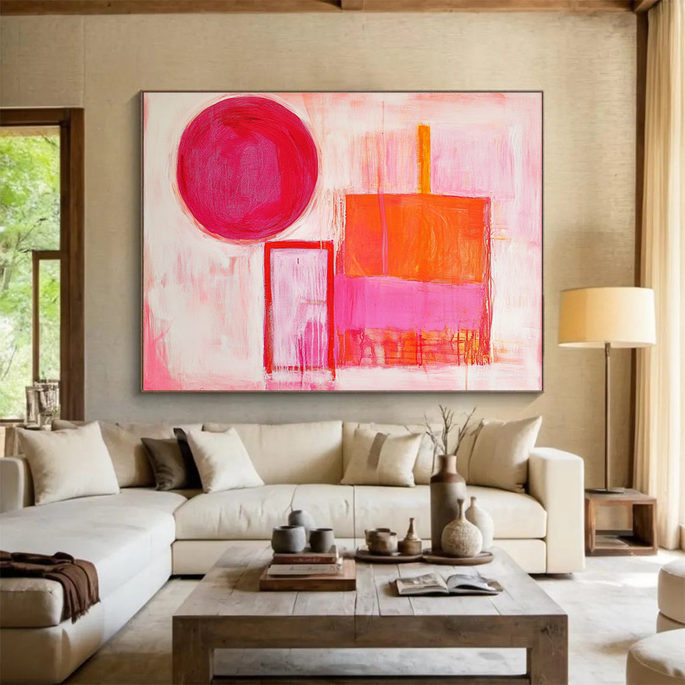 The large abstract painting features thick brush strokes with warm pink and orange hues, showcasing a circle, square, and rectangular shape.SC540