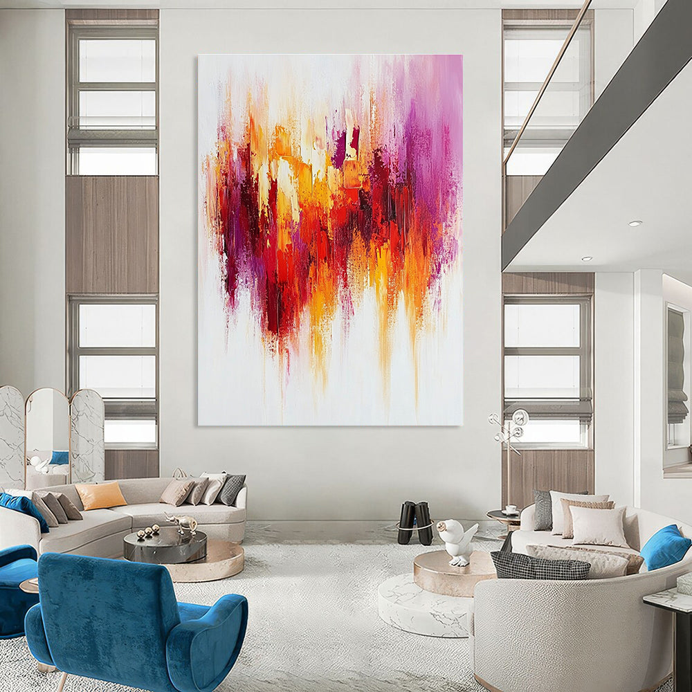 Large abstract painting with textured brush strokes in warm reds and yellows accented by purple on a white background creating a happy uplifting mood.STSC814