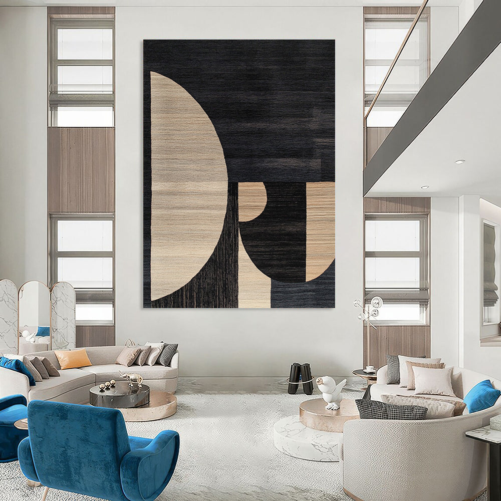 Large abstract rug featuring a minimalistic Bauhaus design with soft edges contrasting dark gray beige black and white tones.STSC1169