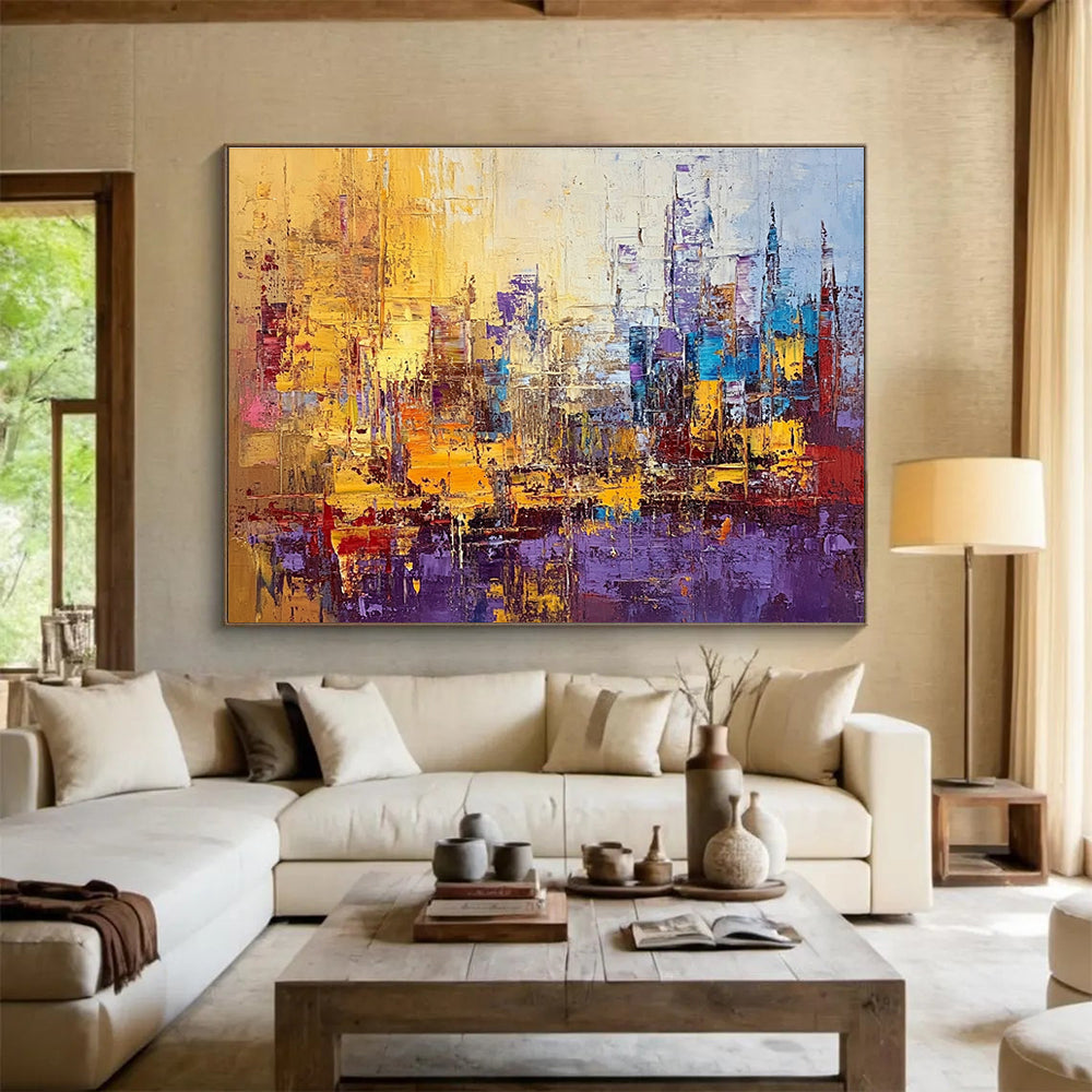 Large abstract painting of a vibrant cityscape in textured gold blue purple and red with impasto strokes and palette knife techniques.SC355
