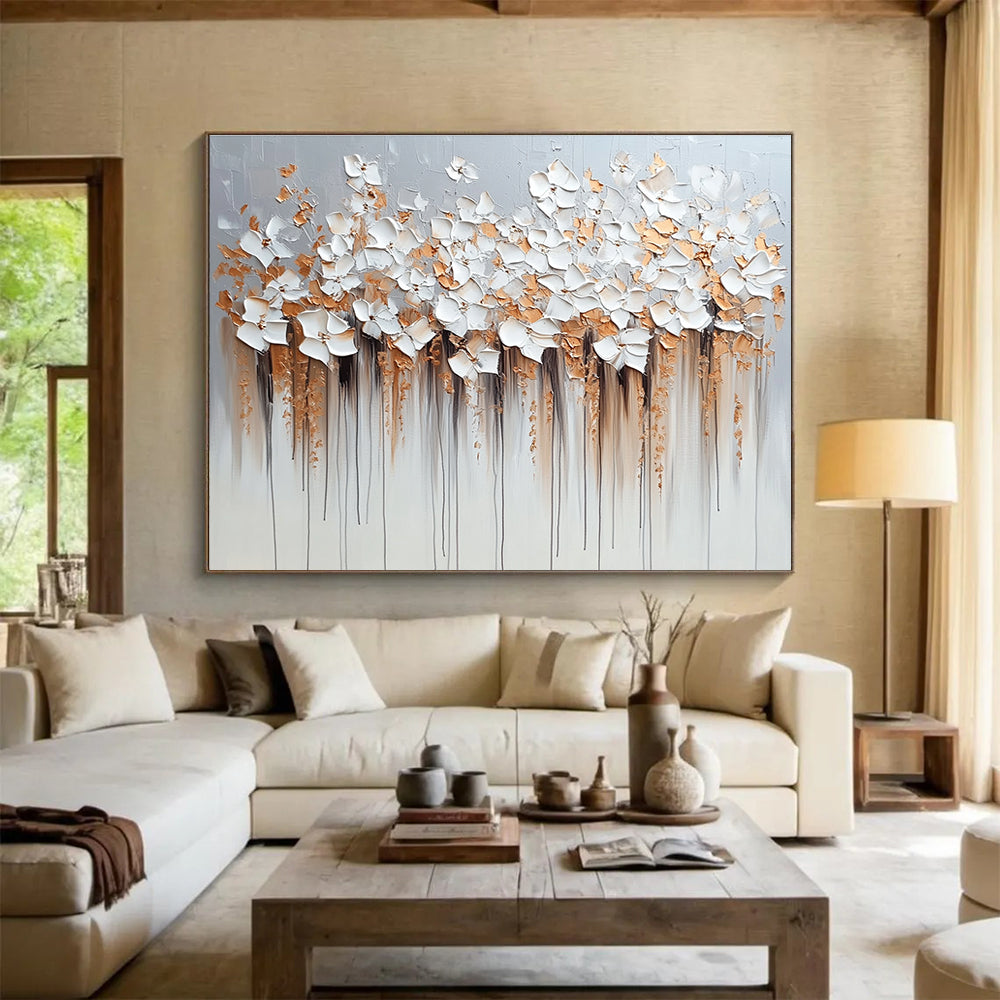 Large abstract painting with flowers in light gray and beige featuring dripped paint technique heavy impasto texture in silver and gold hues.SC294