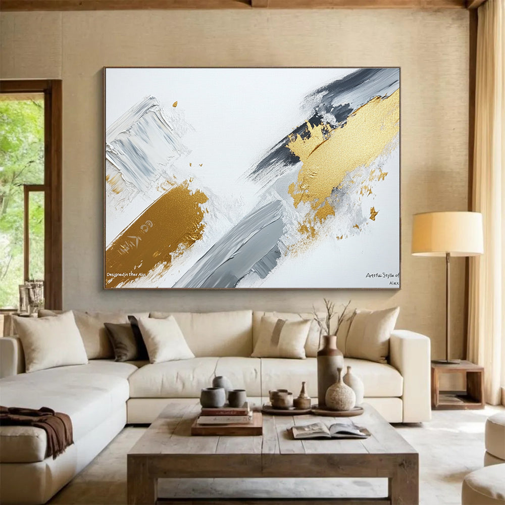 Large abstract painting featuring gray and gold brush strokes on a white background showcasing contemporary artistic creativity and elegance.SC293