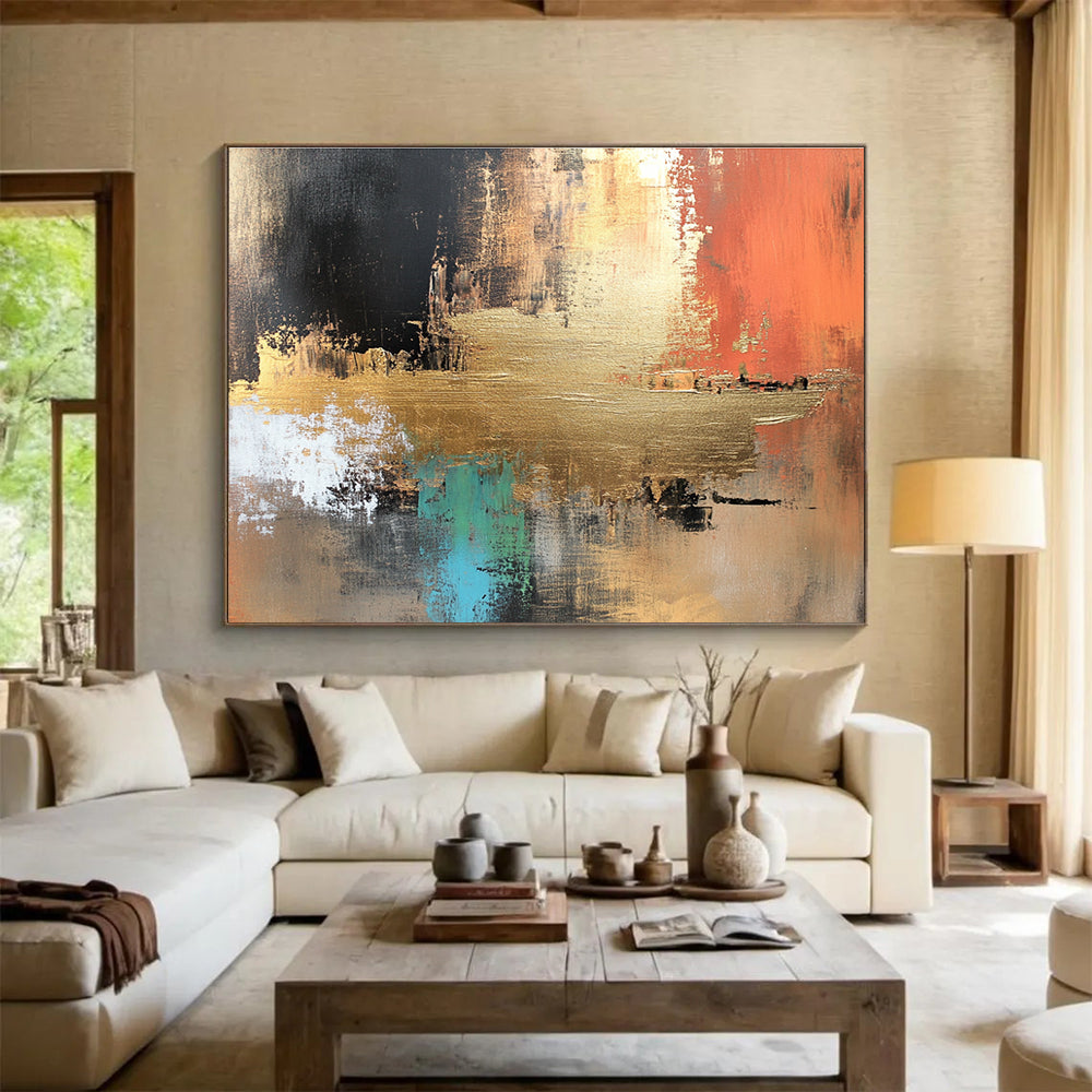 Large abstract canvas painting in golden copper and brown tones with vibrant blue green red black accents featuring white elements and light gold foil details.SC091