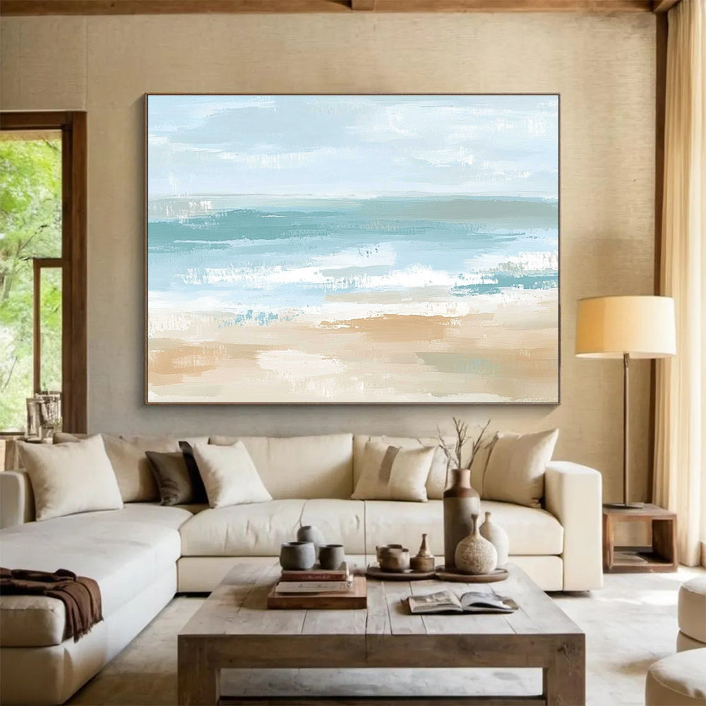 A large abstract painting depicting a serene coastal landscape in soft pastel colors, evoking tranquility with gentle waves and a sandy shore.SC545